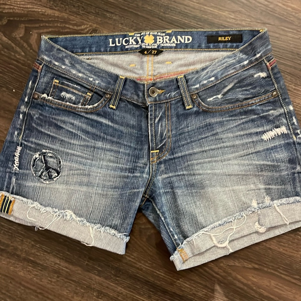 Lucky Brand Jean Shorts with American Flag on back pocket in low-rise. Size 27